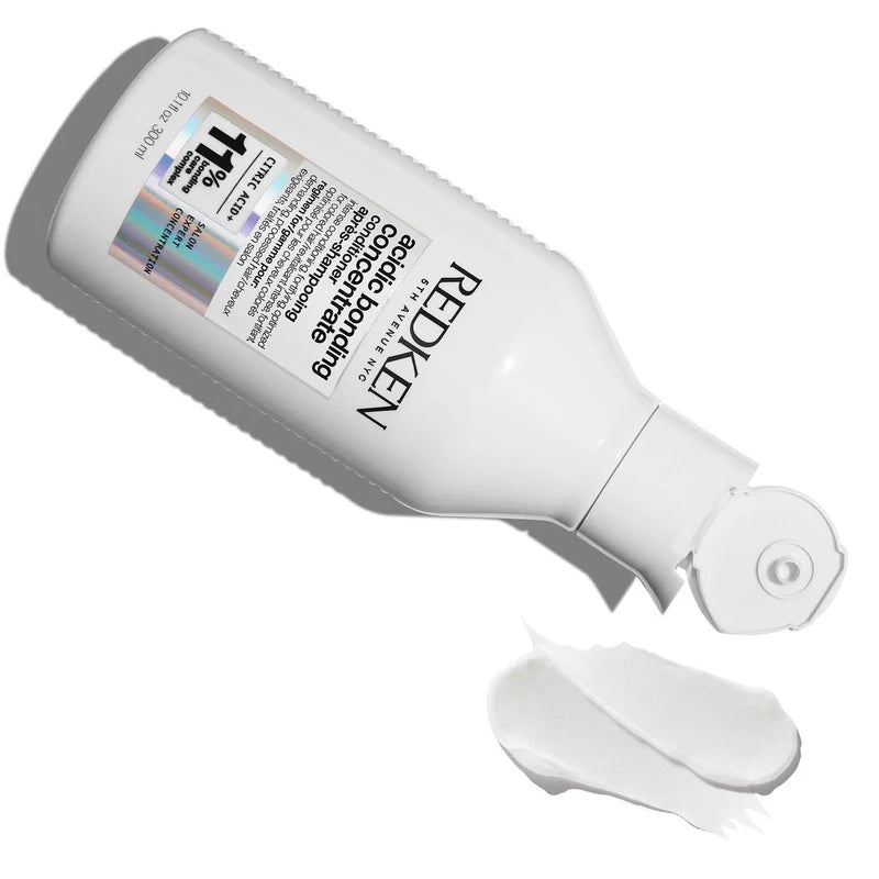 Redken hair product with a white background