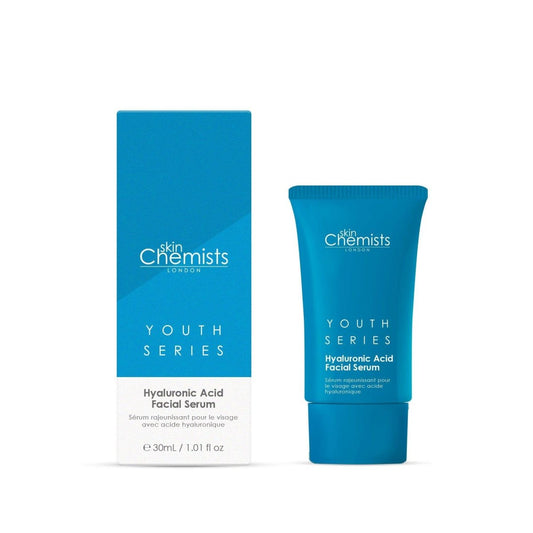 Blue facial serum packaging with 'skin Chemists' branding on a white background