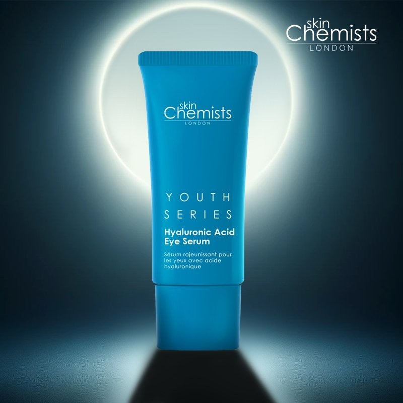 Blue tube of skinChemists Youth Series Hyaluronic Acid Eye Serum on a dark background