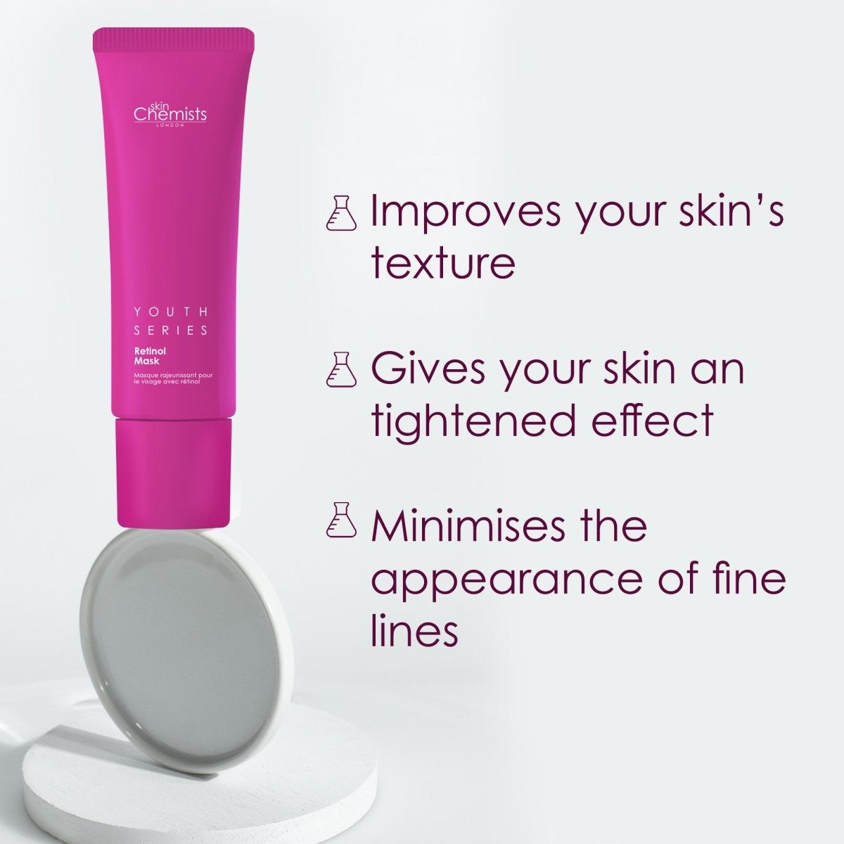 Pink skincare tube with text on a white background