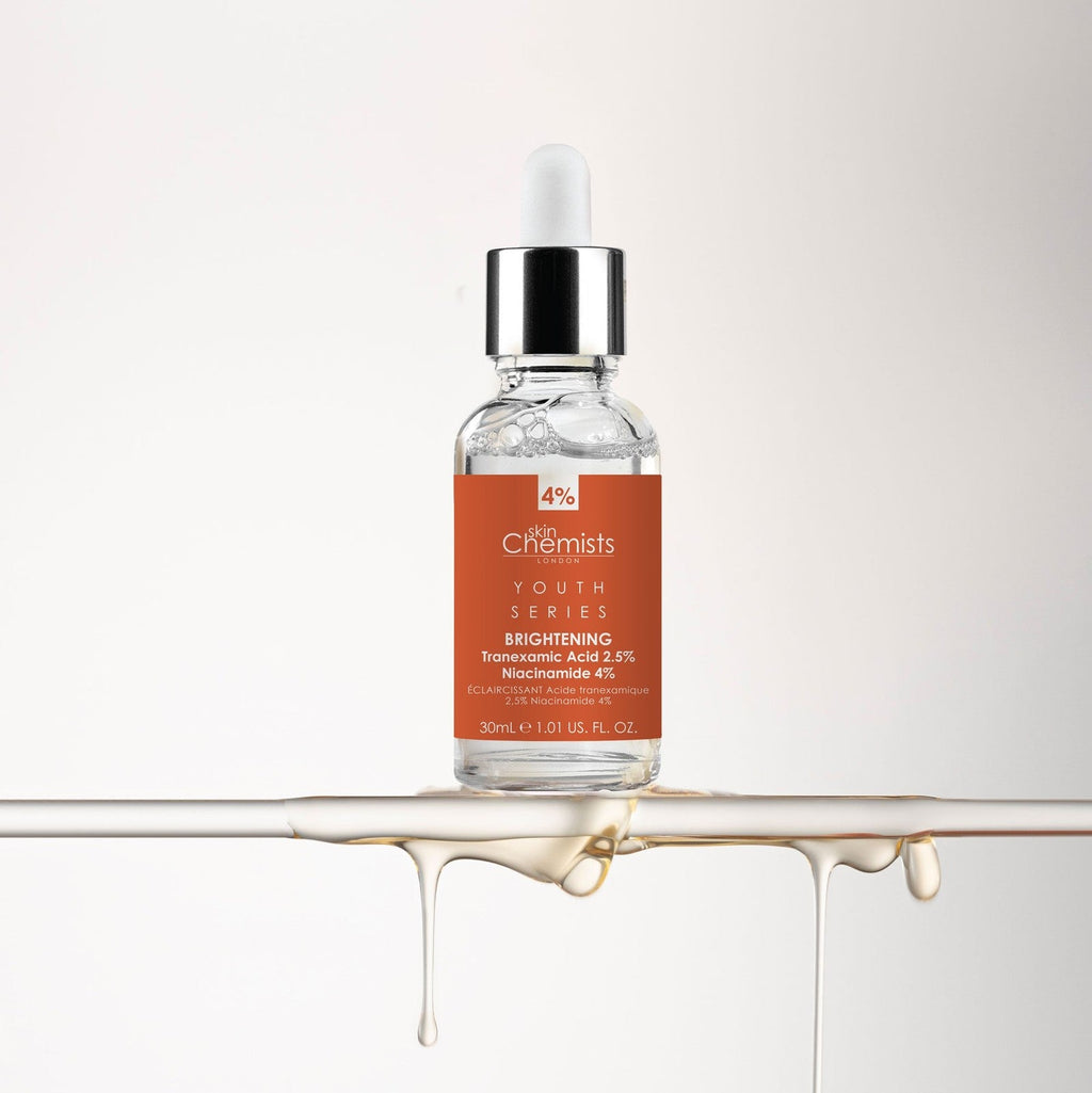 Skincare bottle with orange label on a white background