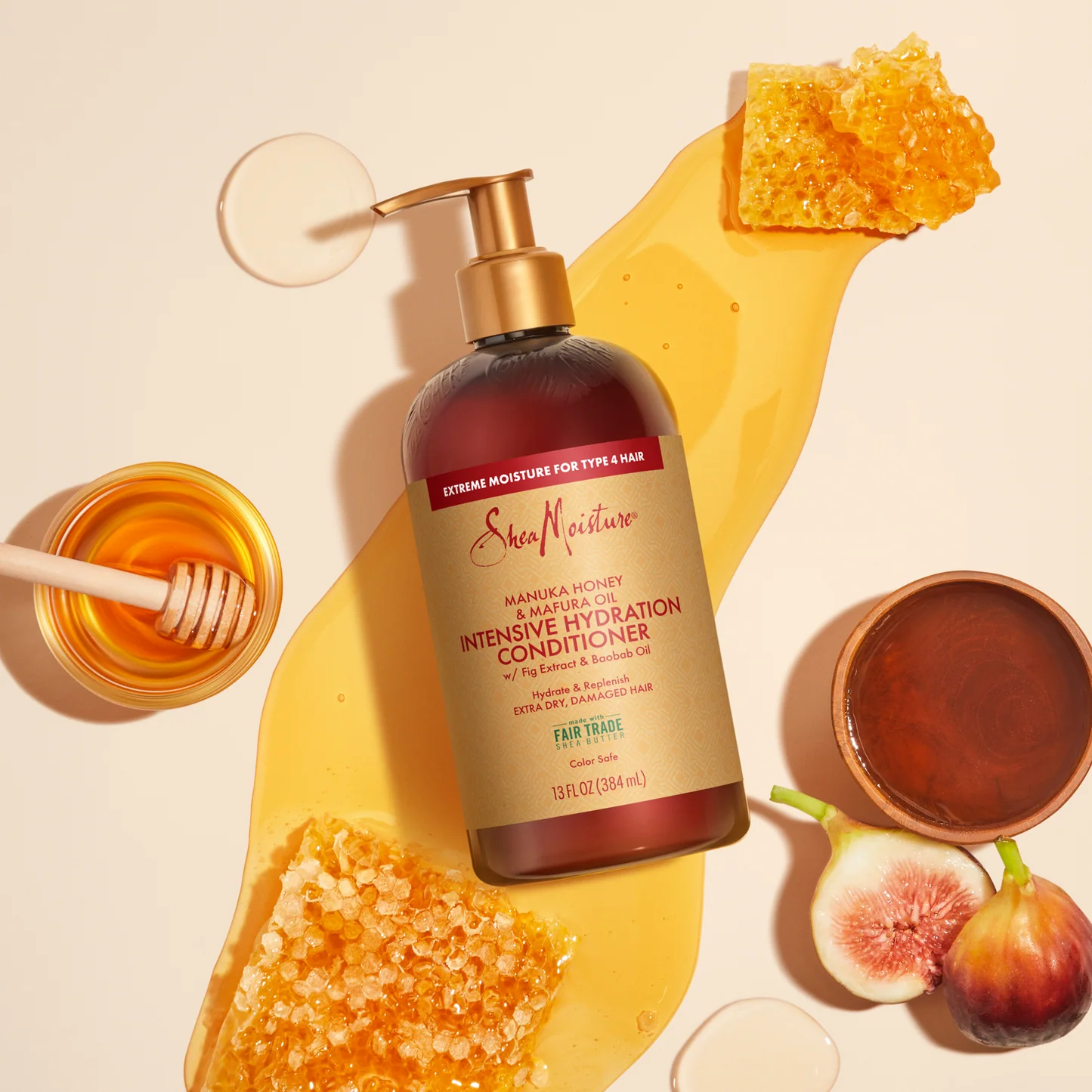 SheaMoisture Manuka Honey Intensive Hydration Conditioner bottle with honeycomb, honey, and figs on a beige background