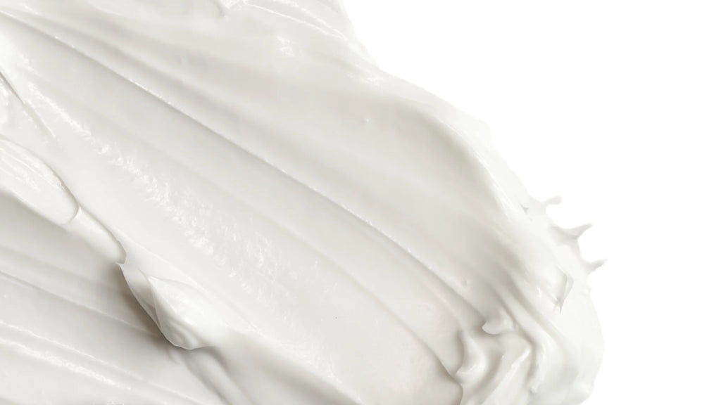 Close-up of white formula with folds on a white background