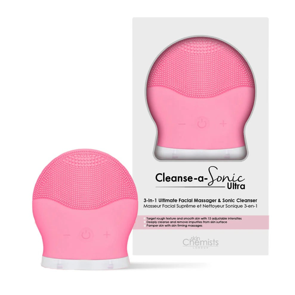 Pink facial cleansing device with packaging on a white background