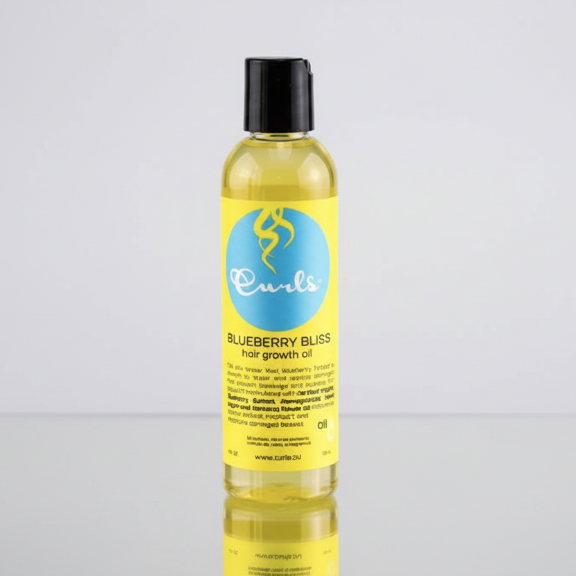 Yellow bottle of Curls Blueberry Bliss hair growth oil on a white background