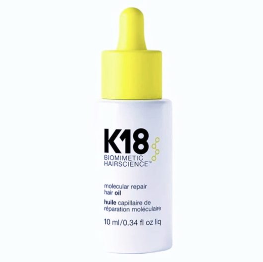 K18 biomimetic hair science hair oil bottle with yellow cap on a white background