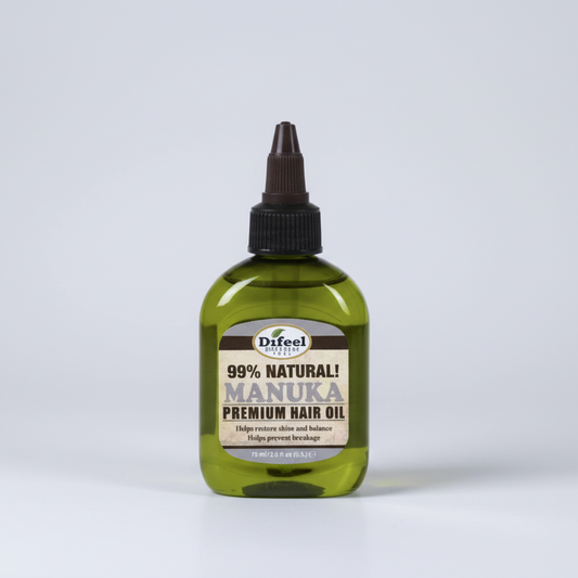 Bottle of Difeel 99% Natural Manuka Premium Hair Oil on a white background
