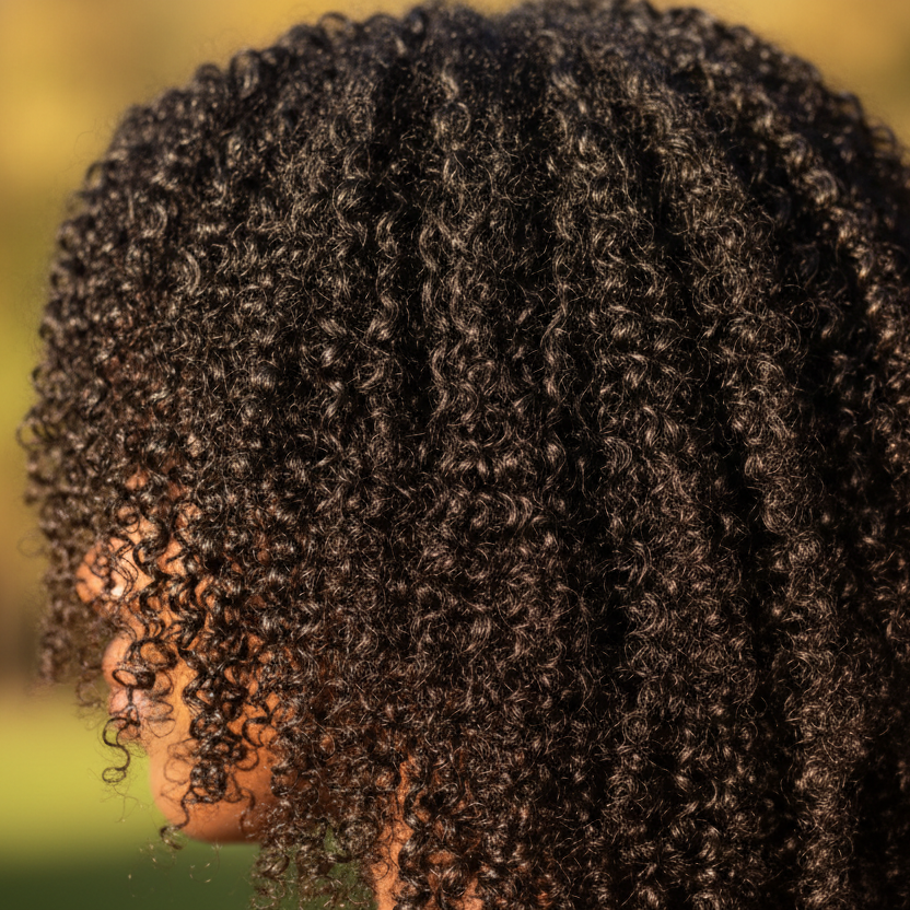 Close-up of deeply conditioned, shiny curls

