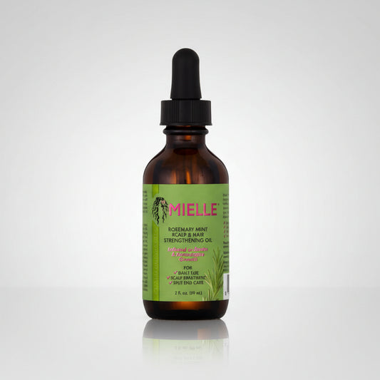 Bottle of Mielle oil with a dropper on a white background
