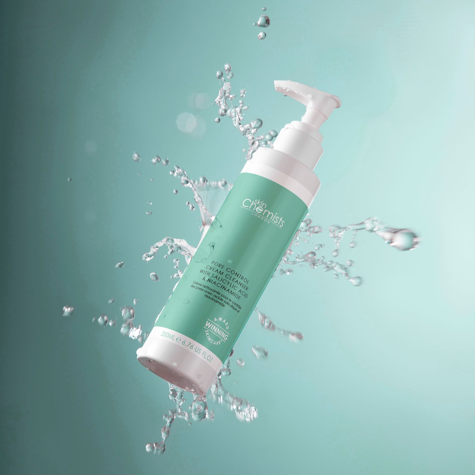 Green and white bottle with water droplets on a teal background