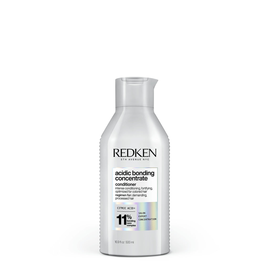 Redken Acidic Bonding Concentrate Conditioner for damaged hair repair, 500ml bottle – professional salon formula for hair strength.