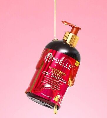 MIELLE hair care product bottle with pump on a pink background